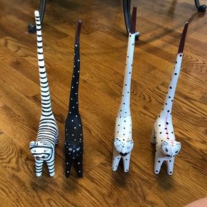 4 wooden Indonesian figurine cats with long tails